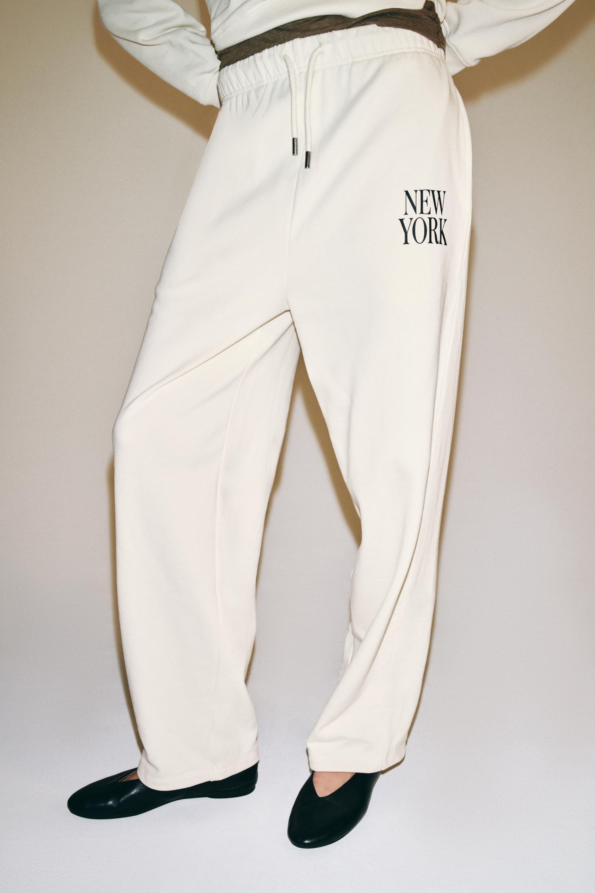 TEXT WIDE-LEG TROUSERS